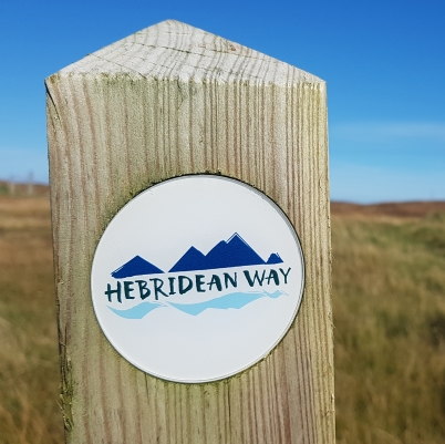 Sign post showing the Hebrdiewan Way Logo