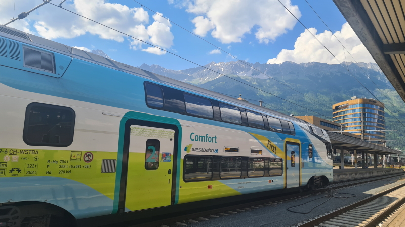 A train about to depart from Innsbruck's bustling station