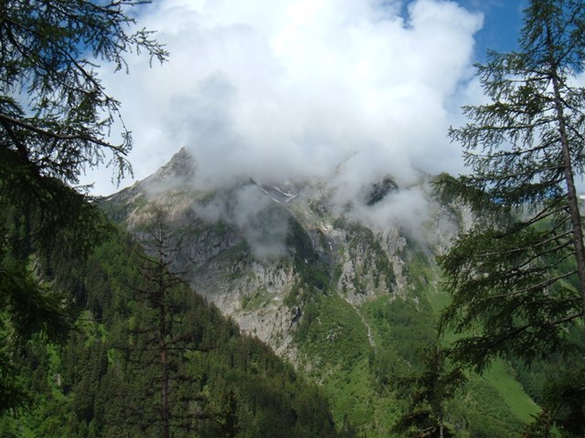 Swirling clouds cover mountainsides near Trient, Swiss Alps