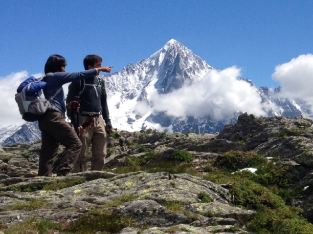 Mountain walkers pointing out the view above Chamonix