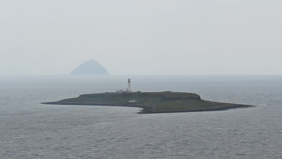 Pladda Lighthouse and a distant Ailsa Craig, from Arran
