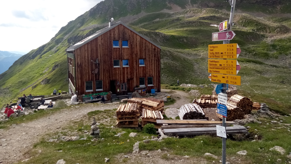 The Kesch hut with its signpost outside