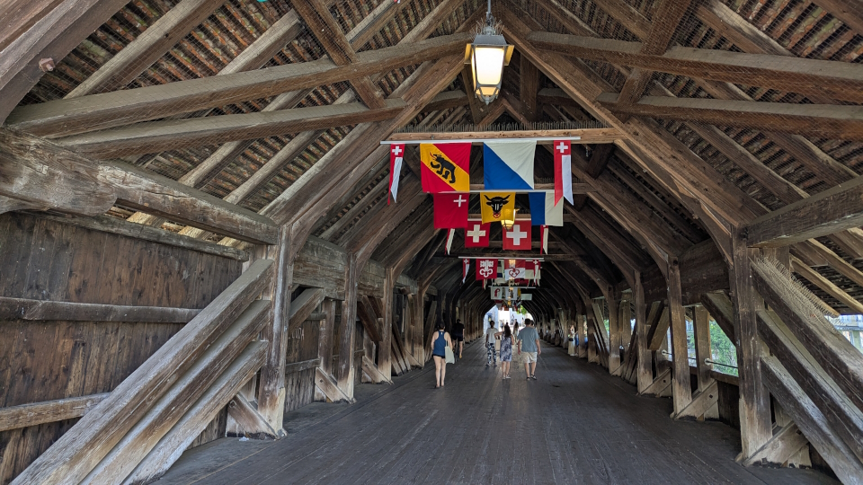 The covered bridge with its flags (Swiss cantons) in the middle of Olten, Switzerland
