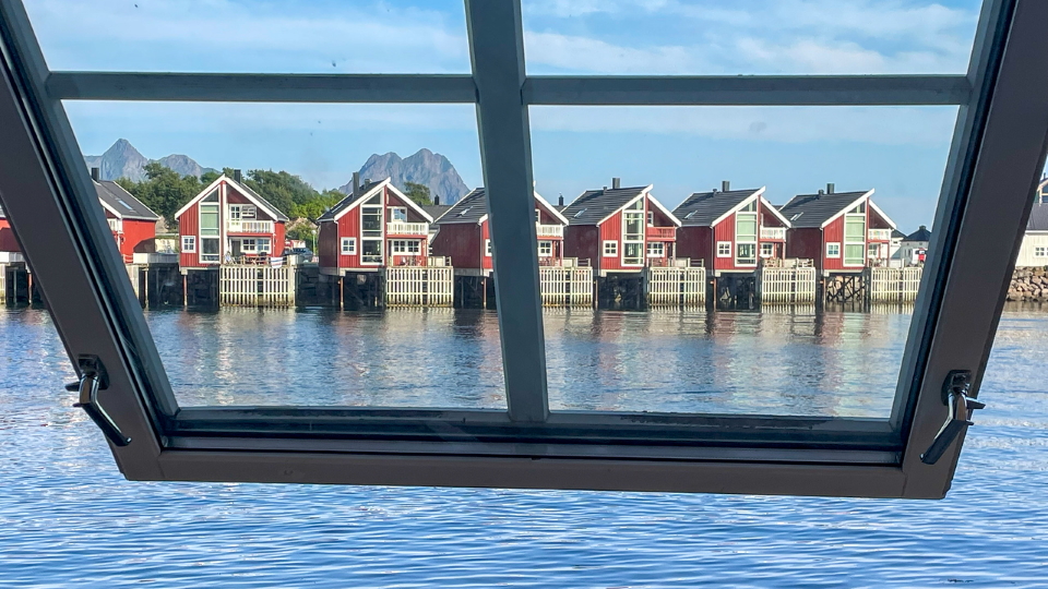 The Lofoten, Norwegian, seaside huts through a window frame