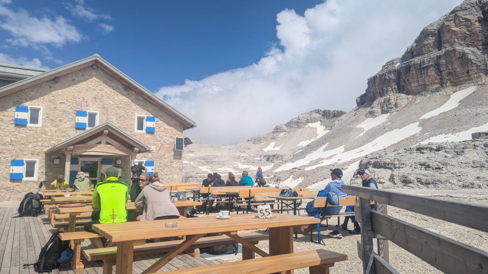 Rifugio Boe with afternoon drinkers on its terrace
