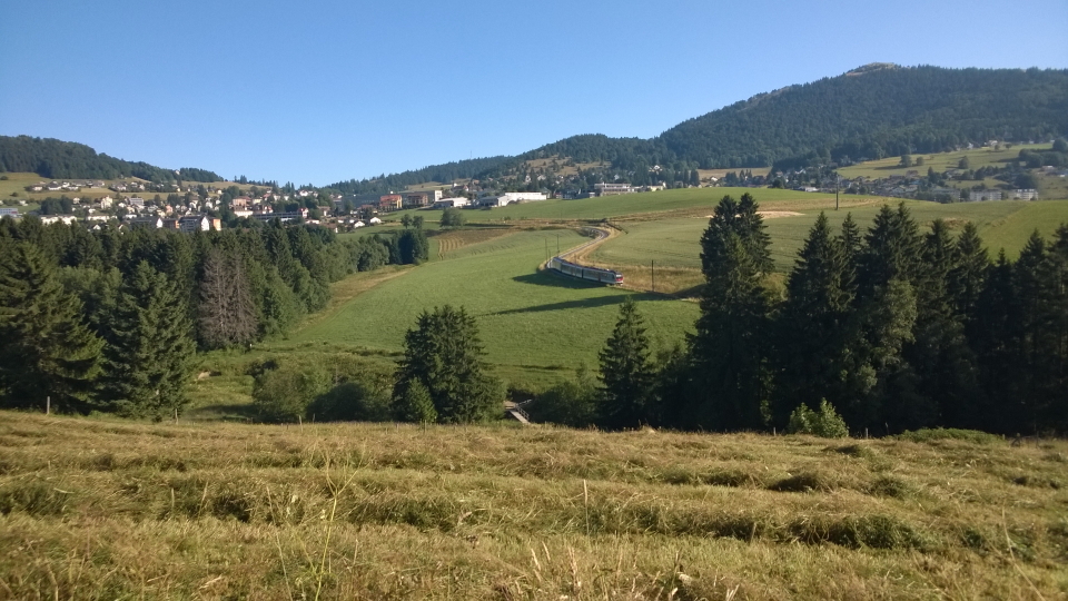 A small Swiss train winds its way South of Sainte-Croix