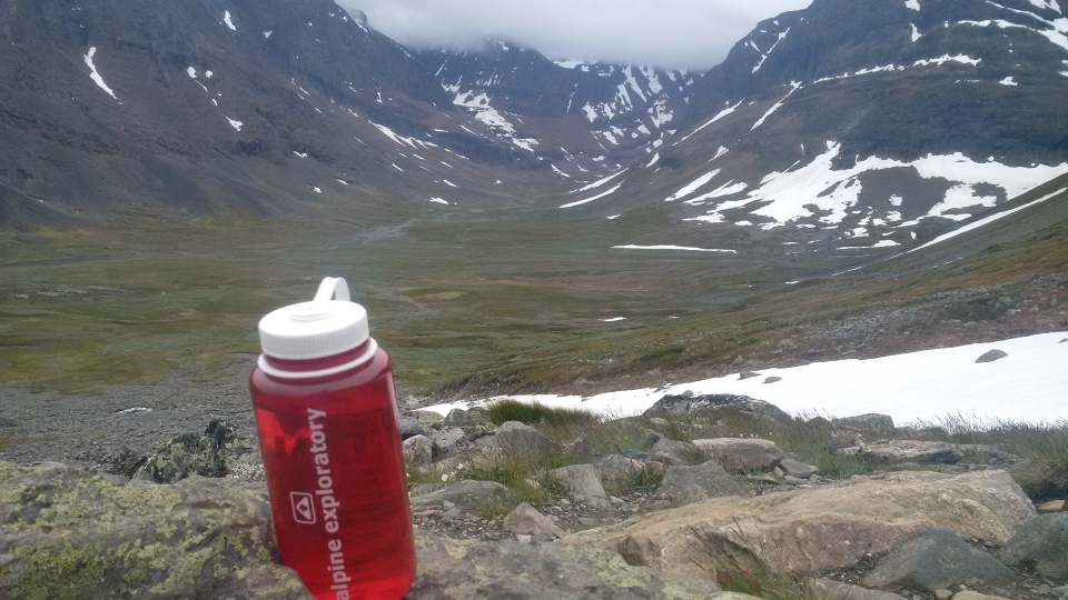 The valley from Singi to Kebnekaise with an Alpine Exploratory water bottle in the foreground