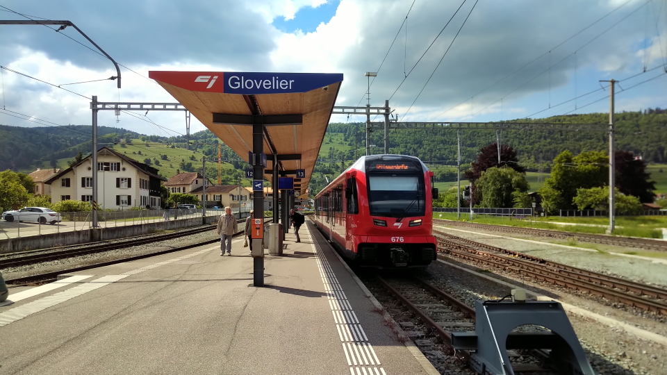The train waits at Glovelier, bound back for La Chaux-de-Fonds