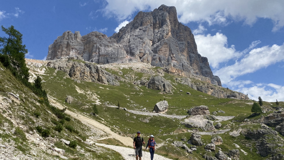 Walkers in the Dolomites, Italy, above Passo Falzarego