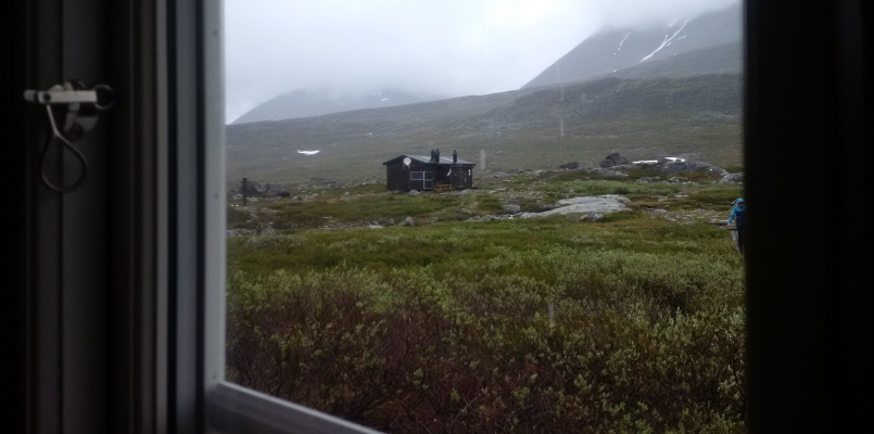 The STF's Singi hut, looking from one cabin to another on a rainy day