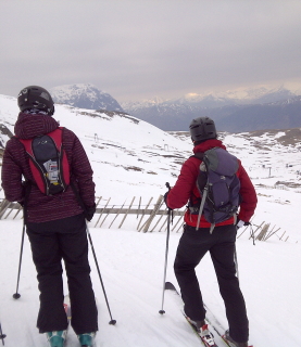 Skiers looking out from Glen Coe